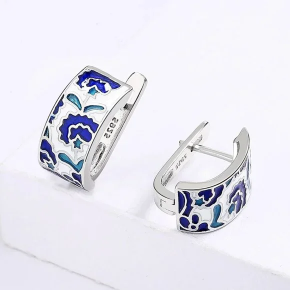Sterling silver earrings with blue acrylic accents. - Picture 2 of 5